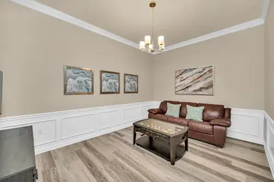 a living room with a couch and a table at Lakeview Condo Directly Next To Pool Near WDW in Orlando
