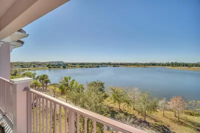 a view of a river from a balcony at Lakeview Condo Directly Next To Pool Near WDW in Orlando