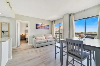 a living room with a couch and a table at Fabulous Resort Condo with Heated Pool! in Orlando