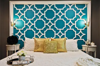 a bedroom with a bed with a blue and white wall at Best Location Pet Friendly Fenced Yard in Orlando
