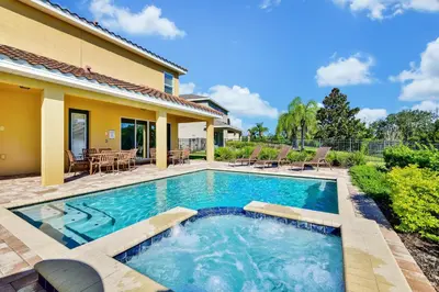 a swimming pool in the backyard of a house at Spectacular Home Near Disney With Private Pool And Waterpark & Resort Access At Encore Resorts Reunion - 7523Mr in Kissimmee