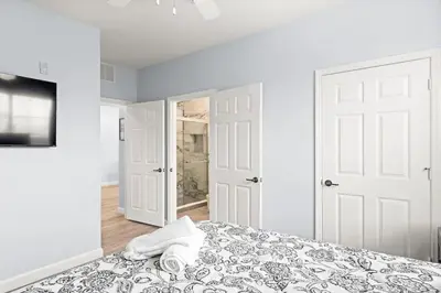 a bedroom with a bed with a towel on it at Home sweet Home near Disneyland in Kissimmee