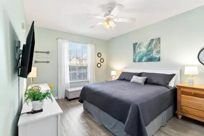 a bedroom with a bed and a flat screen tv at Making Memories At Windsor Palms Resort, Great Amenities And Much More Fun! in Kissimmee