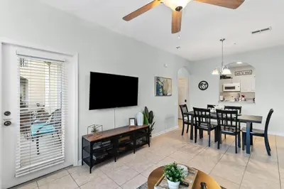 a living room with a table and a dining room at Making Memories At Windsor Palms Resort, Great Amenities And Much More Fun! in Kissimmee