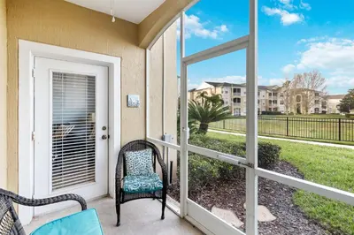 a porch with a chair and a window at Making Memories At Windsor Palms Resort, Great Amenities And Much More Fun! in Kissimmee