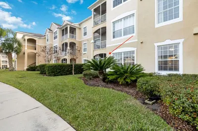 a apartment building with a dog in the front yard at Making Memories At Windsor Palms Resort, Great Amenities And Much More Fun! in Kissimmee
