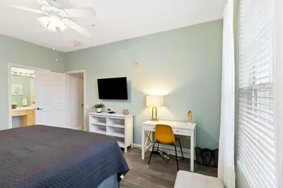 a bedroom with a bed and a desk and a television at Making Memories At Windsor Palms Resort, Great Amenities And Much More Fun! in Kissimmee