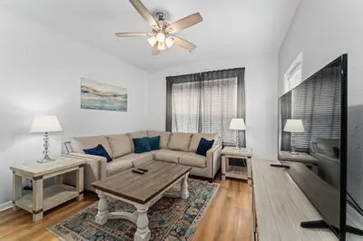 a living room with a couch and a table at Vista Cay Resort in Orlando