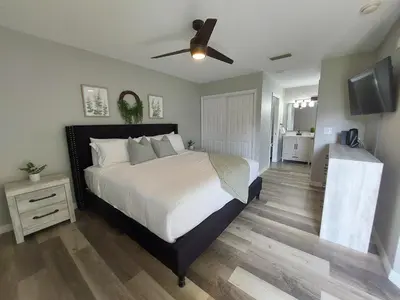 a bedroom with a large bed with a ceiling fan at Amazing 32 Condo, Gated Community At Club Cortile!! in Kissimmee
