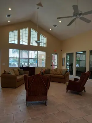 a large living room with couches and a ceiling fan at Amazing 32 Condo, Gated Community At Club Cortile!! in Kissimmee