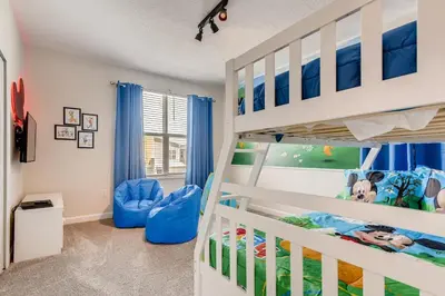 a childs bedroom with a bunk bed at 2751 BD -Luxury 5BR Single Family - Private Pool in Kissimmee