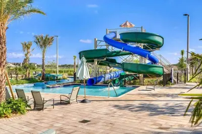 a water slide in a pool at a resort at Magic Lily - Storey Lake By Shine Villas #834 in Kissimmee