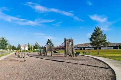 a playground in a park with a slide at Magic Lily - Storey Lake By Shine Villas #834 in Kissimmee