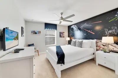 a bedroom with a large white bed and a desk at Star Hideaway At Storey Lake By Shine Villas #716 in Kissimmee