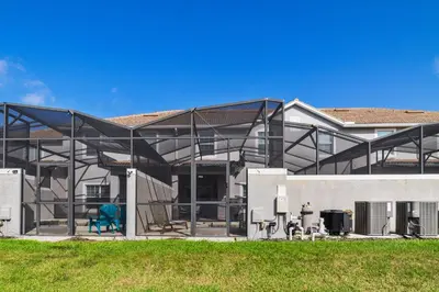 a building with a glass roof and a blue chair at Star Hideaway At Storey Lake By Shine Villas #716 in Kissimmee