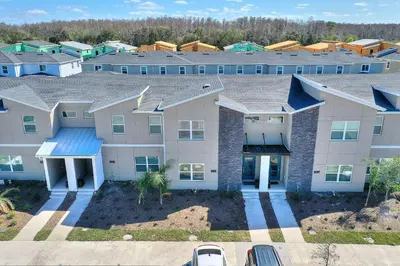an aerial view of a apartment building at Blue Beach At Storey Lake By Shine Villas #400 in Kissimmee
