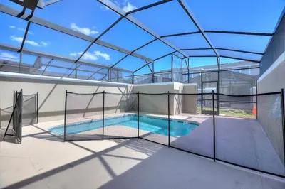 an indoor swimming pool with a glass ceiling at Blue Beach At Storey Lake By Shine Villas #400 in Kissimmee
