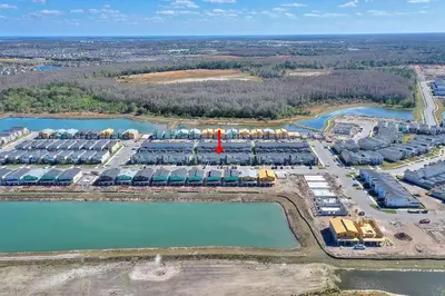 an aerial view of a resort complex next to water at Blue Beach At Storey Lake By Shine Villas #400 in Kissimmee
