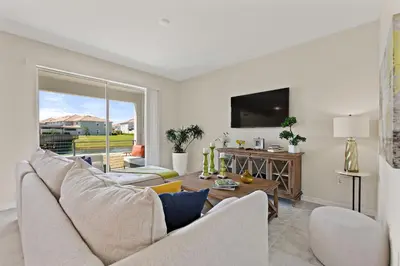 a living room with a couch and a table at Tranquility At Storey Lake By Shine Villas #828 in Kissimmee