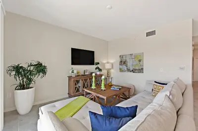 a living room with a couch and a table at Tranquility At Storey Lake By Shine Villas #828 in Kissimmee