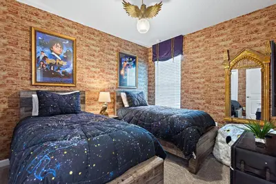 a bedroom with two beds and a mirror at Stars Align Storey Lake By Shine Villas #406 in Kissimmee