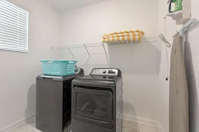 a laundry room with a washer and dryer at Stars Align Storey Lake By Shine Villas #406 in Kissimmee