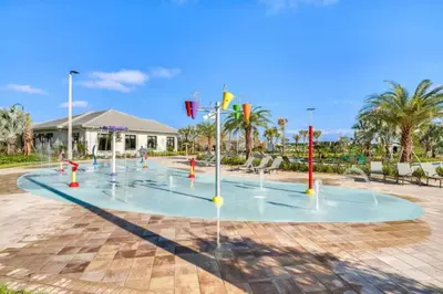 a water park with a bunch of water fountains at Decadent Penguin - Storey Lake By Shine Villas #704 in Kissimmee