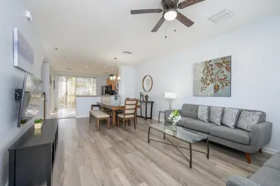 a living room with a couch and a table at Beautiful Townhome, Vista Cay Resort Direct - 4010 in Orlando