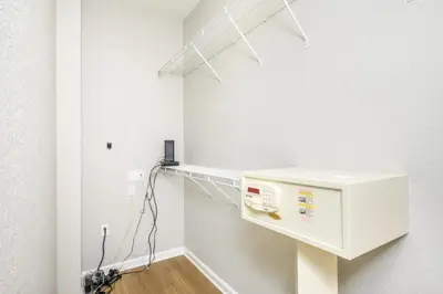 a room with a white wall with a small appliance at Beautiful Townhome, Vista Cay, Near Parks! 4018 in Orlando