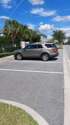 a silver car parked in a parking lot at 350 Pendant · 350 Villa - 8BD - Private Pool - Game room in Orlando