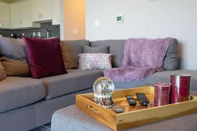 a living room with a couch and a table at Sweet Suite Sleeps 6 Storey Lake By Shine Villas #903 in Kissimmee