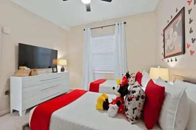 a bedroom with a bed with stuffed animals on it at Edgewater Escape At Storey Lake By Shine Villas #904 in Kissimmee
