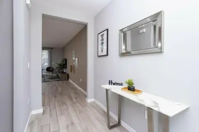 a hallway with white walls and a white counter top at Modern 4 bedroom Home Private Pool 4451 in Kissimmee