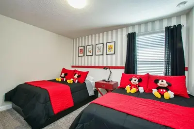 a bedroom with two beds with stuffed animals on them at 4712 Fabulous Brand-New Private Pool in Kissimmee