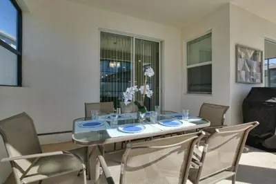 a dining room with a table and chairs at 4712 Fabulous Brand-New Private Pool in Kissimmee