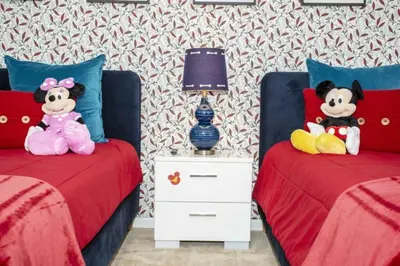 two beds with stuffed animals on them in a bedroom at 2606YA Luxurious En-Suite Single Home Pool in Kissimmee