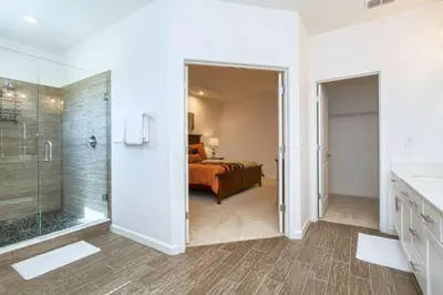 a bathroom with a shower and a bedroom at 2600YA Luxury Gorgeous Private Pool in Kissimmee