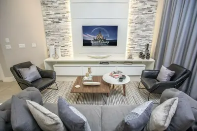 a living room with a couch and chairs and a table at 2620 Magical Memories 15 min-Disney in Orlando