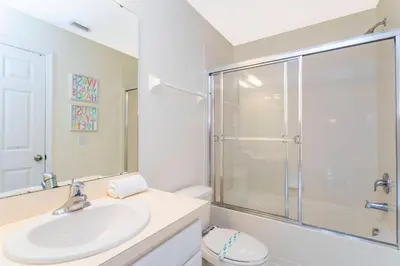 a bathroom with a sink and a shower at Cozy 3 bedroom home with Private Pool 4564 in Kissimmee