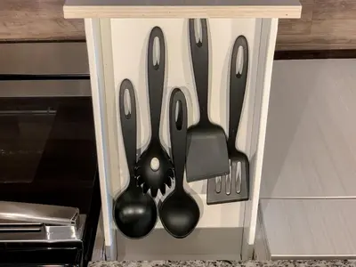 four utensils are hanging in a drawer at Large Apartment, Close To Disney in Kissimmee