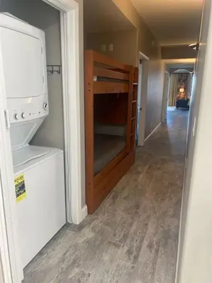 a hallway of a house with a bunk bed in it at Lake view condo close to Disney in Orlando