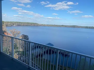 a balcony with a view of a large body of water at Lake view condo close to Disney in Orlando