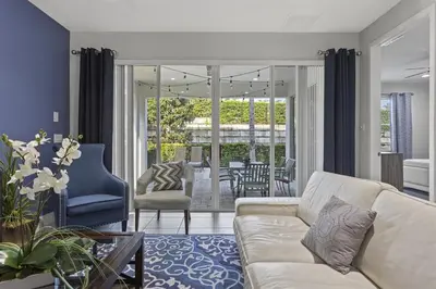 a living room with a couch and a table and chairs at 350-360 Huge Villas - near Disney - 15 BDs in Orlando