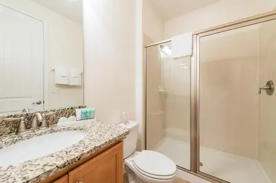 a bathroom with a sink and a toilet and a shower at 350-360 Huge Villas - near Disney - 15 BDs in Orlando
