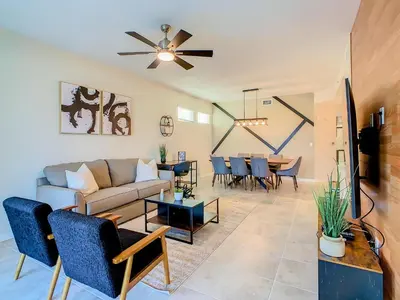 a living room with a couch and a table at Homely Lakeview 3BR Condo with Waterpark in Kissimmee