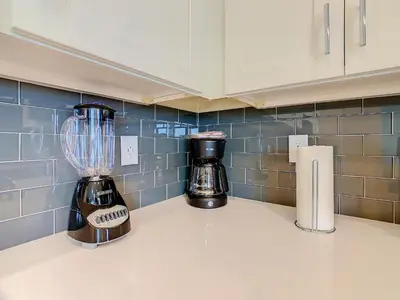 a kitchen counter with a blender on a counter top at Gorgeous 2BR lakeview Condo with Waterpark in Kissimmee