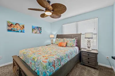 a bedroom with a bed and a ceiling fan at Near Disney, Recently Renovated, Clubhouse in Kissimmee