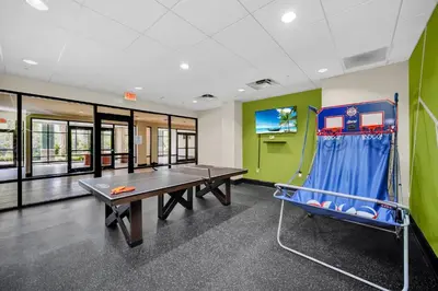 a ping pong room with a ping pong table at Upstay - Pet-Friendly Suite w Pool, Sauna in Orlando