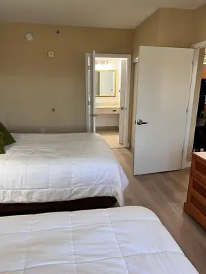 a bedroom with two beds and a sliding door at Great Condo Incredible Location in Orlando