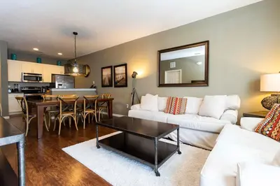 a living room with a white couch and a table at 5366 Unit 17-106 Lovely home inside Disney area in Kissimmee